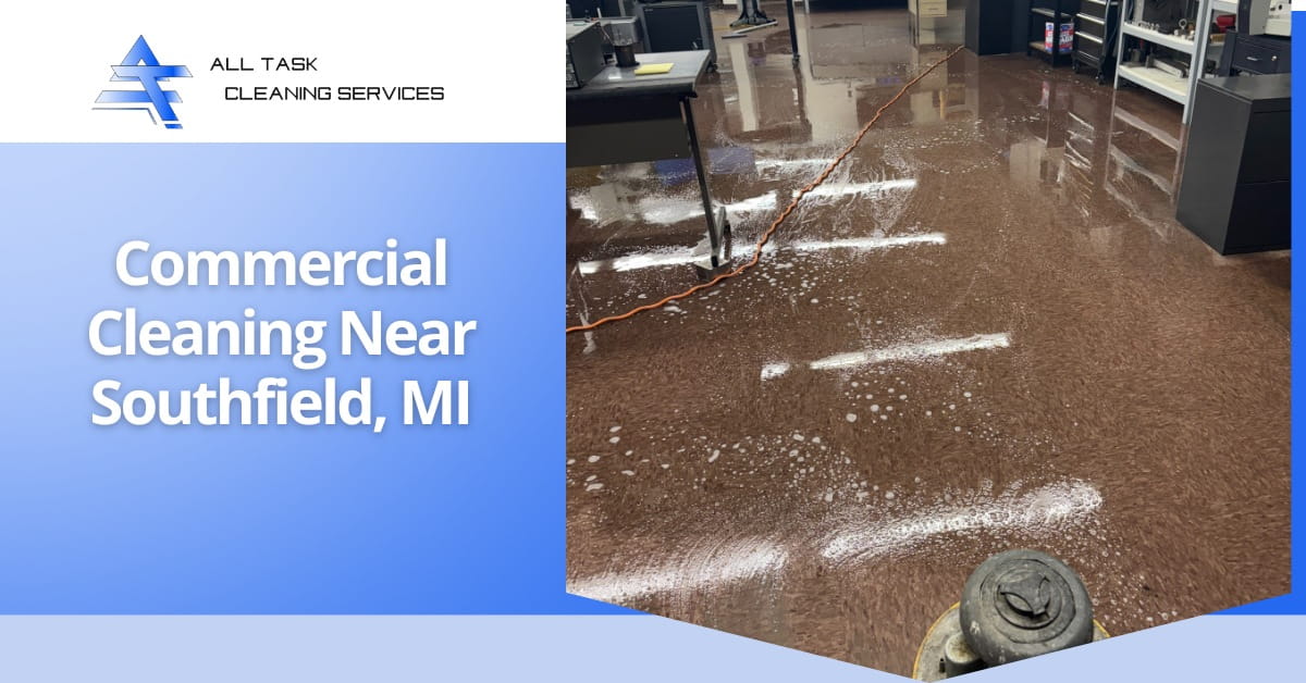 An advertisement for All Task Cleaning Services with a blue gradient background on the left showing the company logo and text 'Commercial Cleaning Near Southfield, MI.' The right side displays a photo of a dark, textured floor being cleaned with visible foam and an orange electrical cord leading to a floor cleaning machine.
